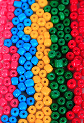 Different colorful beads close-up