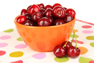 Cherry berries in bowl isolated on white