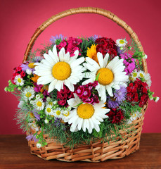 Fototapeta na wymiar Beautiful bright flowers in wicker basket