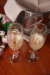 Champagne and glasses on round table close-up