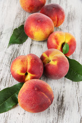 Peaches on wooden table