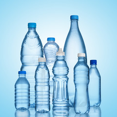 many water bottles on blue background