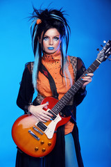 Obraz premium Rock girl posing with electric guitar playing hard-rock isolated