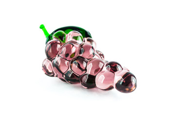 Gems arranged in the form of grapes on white background