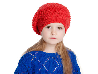 little girl in a red cap smiles, isolation on white