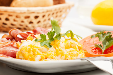Closeup of scrambled eggs with bacon