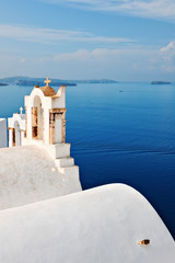 Bell towers overlooking the sea in Oia