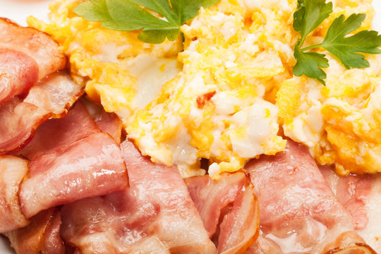 Closeup of scrambled eggs with bacon