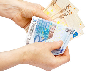 Euros in hand at white background