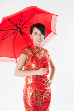 Chinese Woman In Cheongsam With Red Umbrella