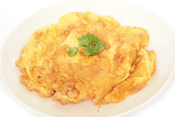 fried beaten egg with parsley on top - Thai style omelet