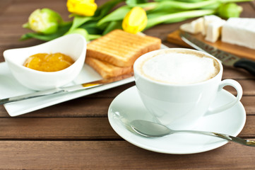 cup of coffee, cheese, toasted bread and mango jam