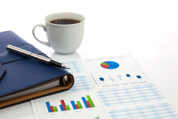 Business report with cup of coffee