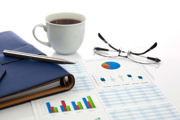 Business report with cup of coffee
