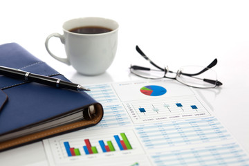 Business report with cup of coffee