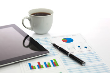Business report with cup of coffee