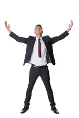 joyful dynamic businessman looks upwards