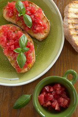 Bruschetta with tomato, basil and olive oil.