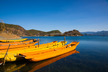 wooden boats in the Lugu lake