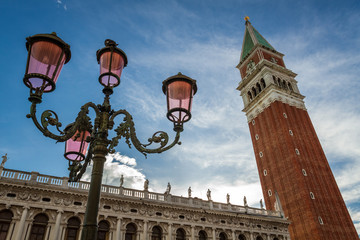 Fototapeta na wymiar Bell tower and street lamp on St. Mark's Square, Venice