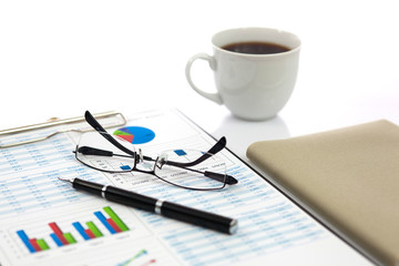 Business report with cup of coffee