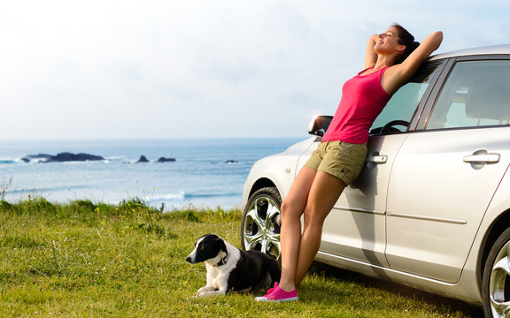 Happy woman and dog travel
