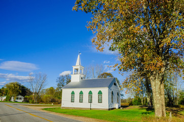 A Small White Church in the Countryside in Autumn