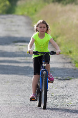 Naklejka premium Teens girl on bike