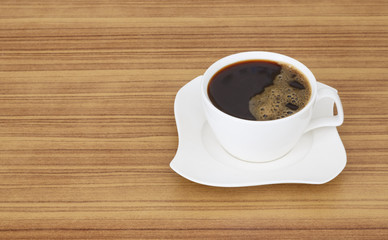 black coffee top view on wooden desk