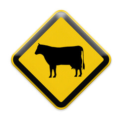 Cow warning sign on roadside