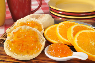 Fototapeta na wymiar Orange marmalade on an English muffin