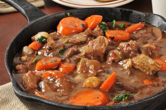 Gourmet beef stew served in a cast iron skillet