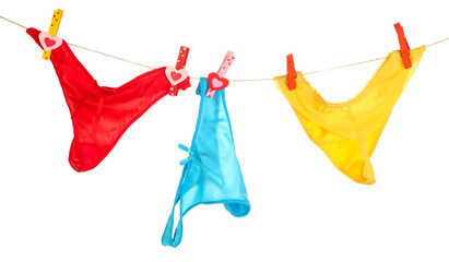 Women's panties hanging on rope isolated on white