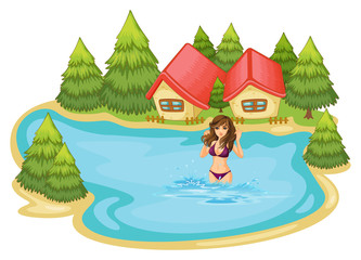 Obraz na płótnie Canvas A girl with a purple bikini swimming at the beach with pine tree