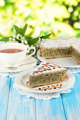 Delicious poppy seed cake with cup of tea