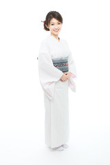 Beautiful young woman wearing japanese traditional kimono
