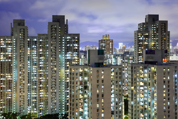 Naklejka premium Apartment building in Hong Kong at night