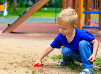 little boy in the sandbox