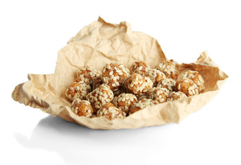 Tasty peanuts with sesame and caramel, isolated on white