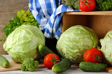 Composition of vegetables on table on wooden background