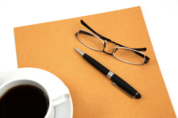 folder with coffee cup on table