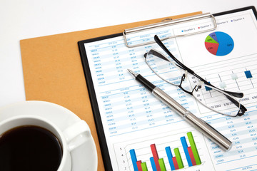 Business report with cup of coffee