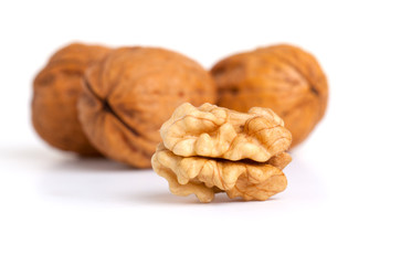 walnut and a cracked walnut isolated on the white background
