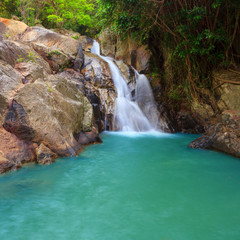 Fototapeta premium Waterfall with pool in tropical jungle, Na Muang, Koh Samui