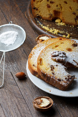 Fruitcake with nuts, raisin and sugar powder