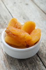 dry apricot on wooden background close up
