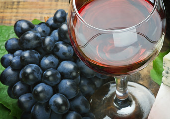 glass of red wine and grape