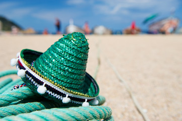 Green Spanish straw hat at beach