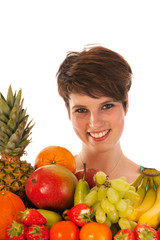 Obraz premium Pretty woman with fresh fruit