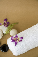 Obraz na płótnie Canvas orchid on white towel